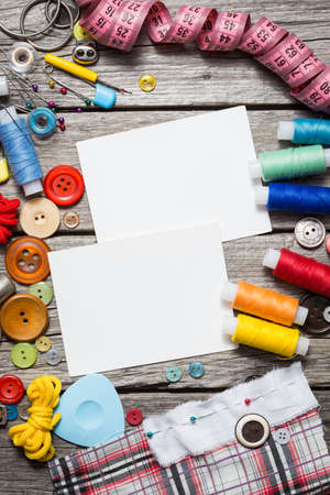 thread and sewing on wooden boardsの写真素材