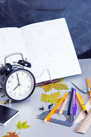 School supplies on the background of the teachers' boardの写真素材