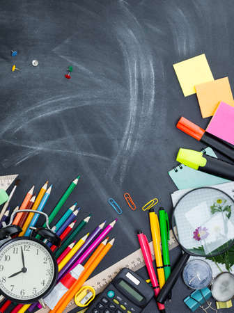School supplies on the background of the teachers' boardの写真素材