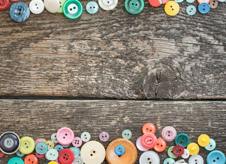 old buttons on wooden boardsの写真素材