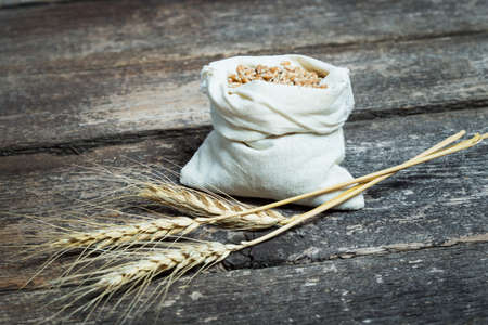 bag with wheat grains and earsの写真素材