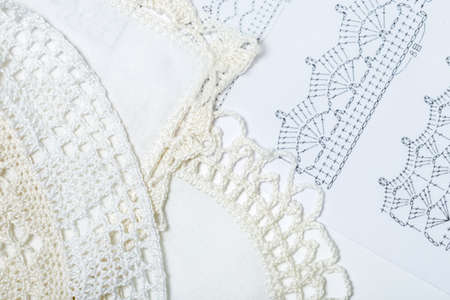 Handmade crocheted pot with wool and crocheting hookの写真素材