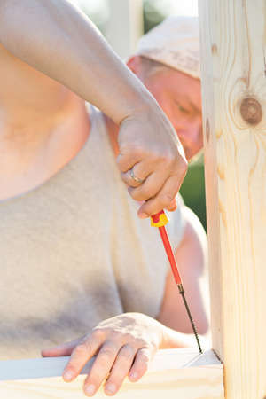 man enjoys working with a screwdriverの写真素材