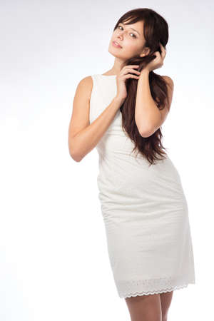 beautiful young girl standing in the studioの写真素材