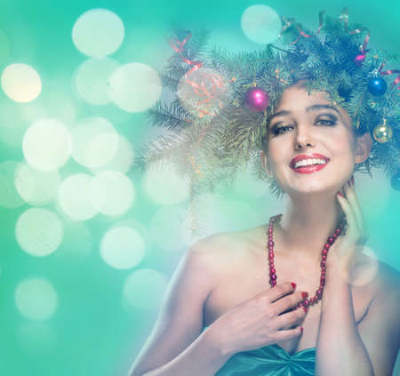 The girl in a wreath of fir branchesの写真素材