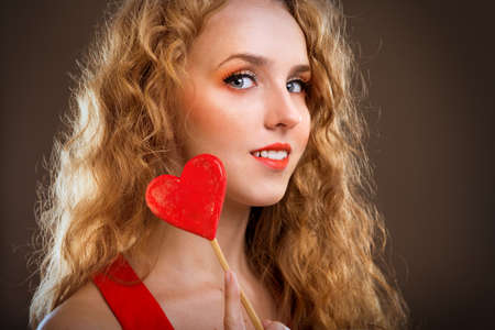 young girl with a heart in his hands