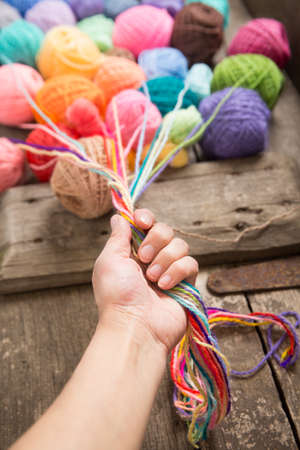 Knitting on the old boardの写真素材