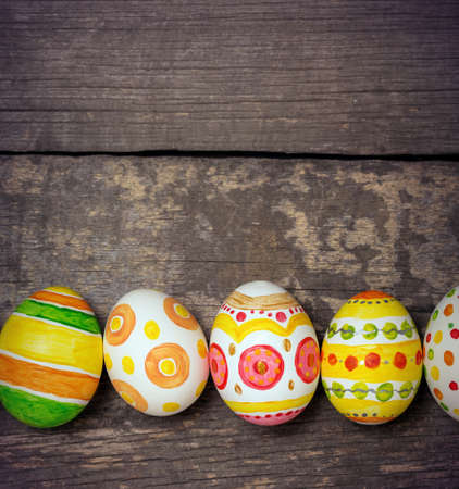 Easter eggs on wooden backgroundの写真素材
