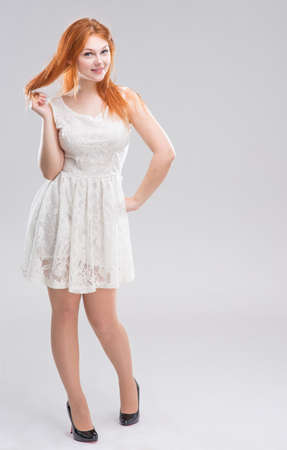 The red-haired girl in white dress