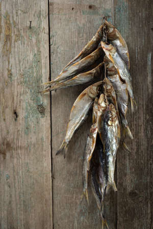 Dried fish on old boardsの写真素材