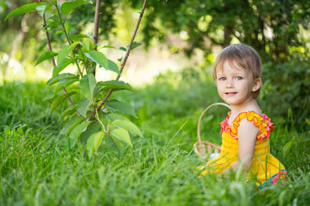 Baby girl playing in the gardenの写真素材