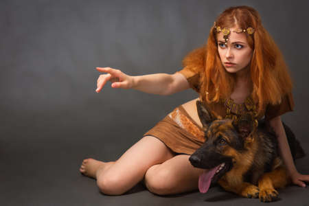 Amazon Girl in a suit with a dogの写真素材