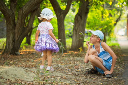 Two children playing in the parkの写真素材