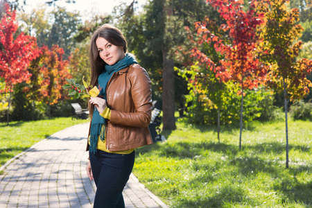 Young woman in autumn parkの写真素材