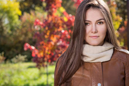 Young woman in autumn parkの写真素材