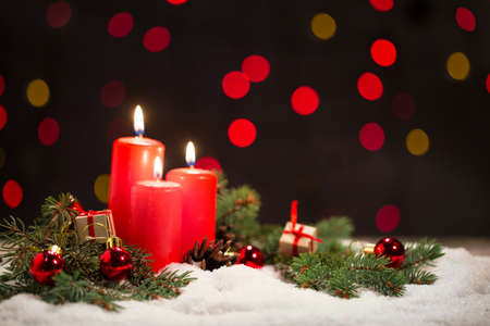 Candles on the background of lights Christmasの写真素材