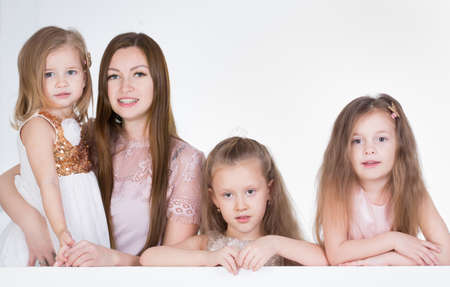 mom with three kids Girls in a studioの写真素材