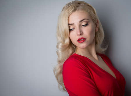 Beautiful girl with hair the evening in the studioの写真素材