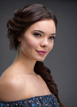 Beautiful woman with hair in the form of spitの写真素材