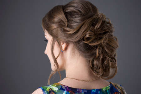 beautiful young woman with evening hairstyle