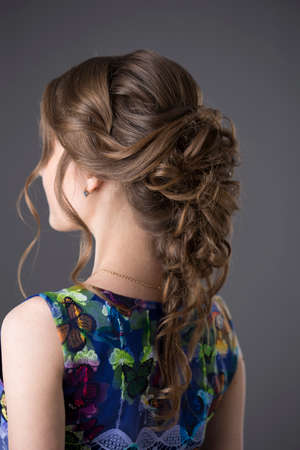 beautiful young woman with evening hairstyleの写真素材
