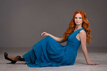 beautiful young woman with red hair beautiful,  red-haired girl with curlsの写真素材