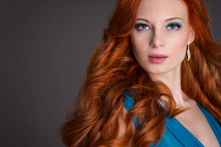 beautiful young woman with red hair beautiful,  red-haired girl with curlsの写真素材