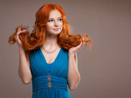 beautiful young woman with red hair beautiful,  red-haired girl with curlsの写真素材