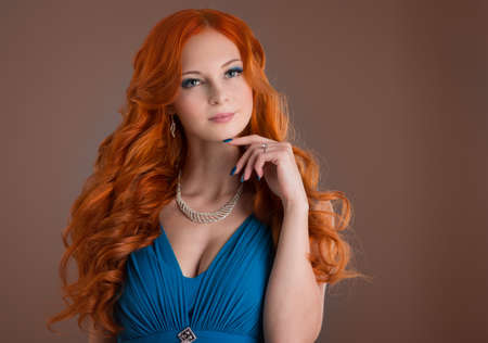 beautiful young woman with red hair beautiful,  red-haired girl with curlsの写真素材