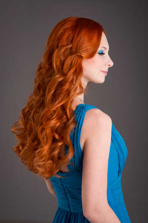beautiful young woman with red hair beautiful,  red-haired girl with curlsの写真素材