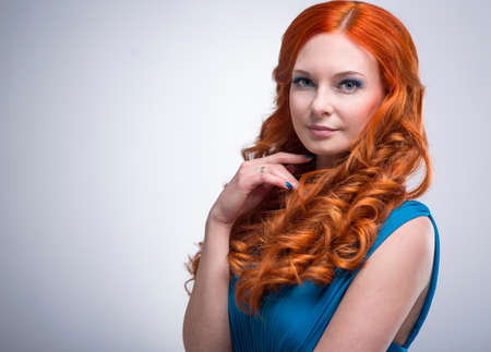 beautiful young woman with red hair beautiful,  red-haired girl with curlsの写真素材
