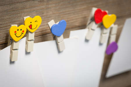 White card on clothespins hanging on the ropeの写真素材