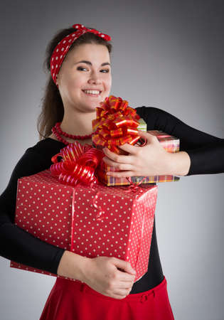 cheerful girl with a gifts in their hands