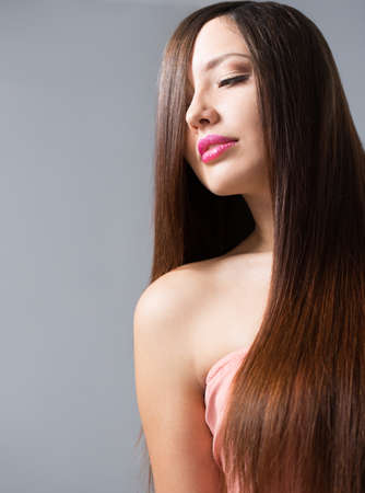 young woman with long beautiful hairの写真素材