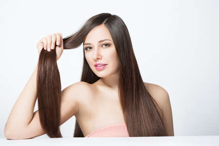 young woman with long beautiful hairの写真素材