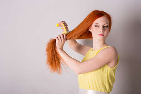 Young red-haired woman with long hairの写真素材