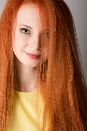 Young red-haired woman with long hair