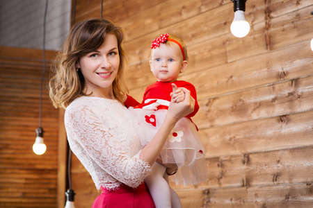 Mom with baby of eleven months of age in the roomの写真素材