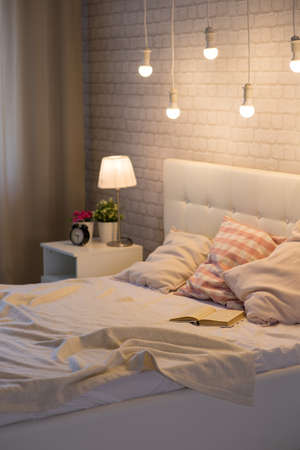 White bed in the interior of the bedroomの写真素材