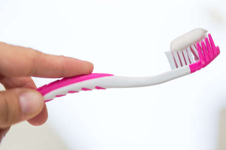 Toothbrush in the hand of a teenager
