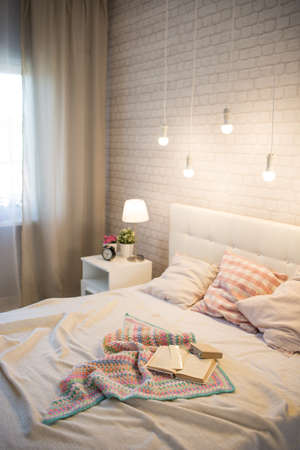Book on the bed in the bedroom interior