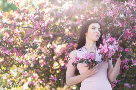 Young woman in the park in the springの写真素材