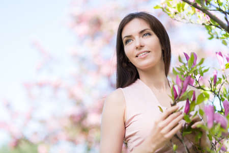 Young woman in the park in the spring