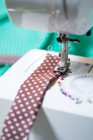 Sewing machine with a strip of tissueの写真素材