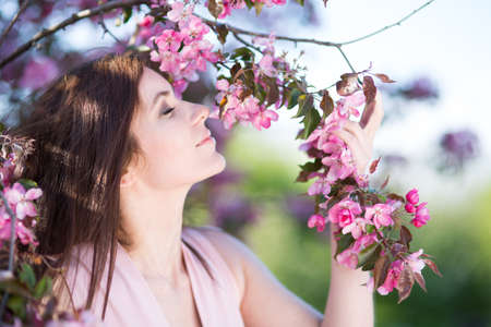 Young woman in the park in the springの写真素材