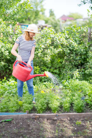 Young woman in a summer gardenの写真素材
