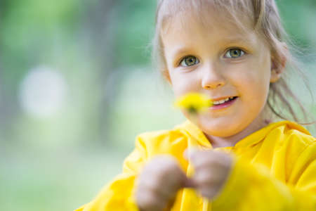 A girl of three years of age plays in natureの写真素材