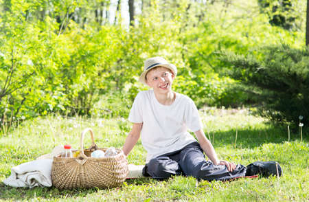 Boy at a picnic in the parkの写真素材