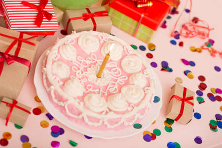 Birthday cake with a candleの写真素材