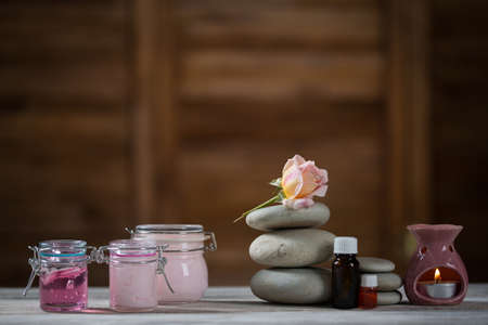 Beautiful composition of spa treatment on white wooden tableの写真素材